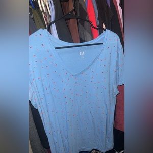 light blue soft t shirt with coral black stemed flower print